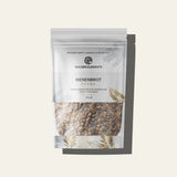 Standbeutel von Golden Elements mit Bienenbrot (Perga). Die Verpackung ist weiß mit goldenen Blättermotiven, zeigt durch ein Sichtfenster die fermentierten Blütenpollen und trägt die Aufschrift „100% fermentierte Blütenpollen direkt vom Imker