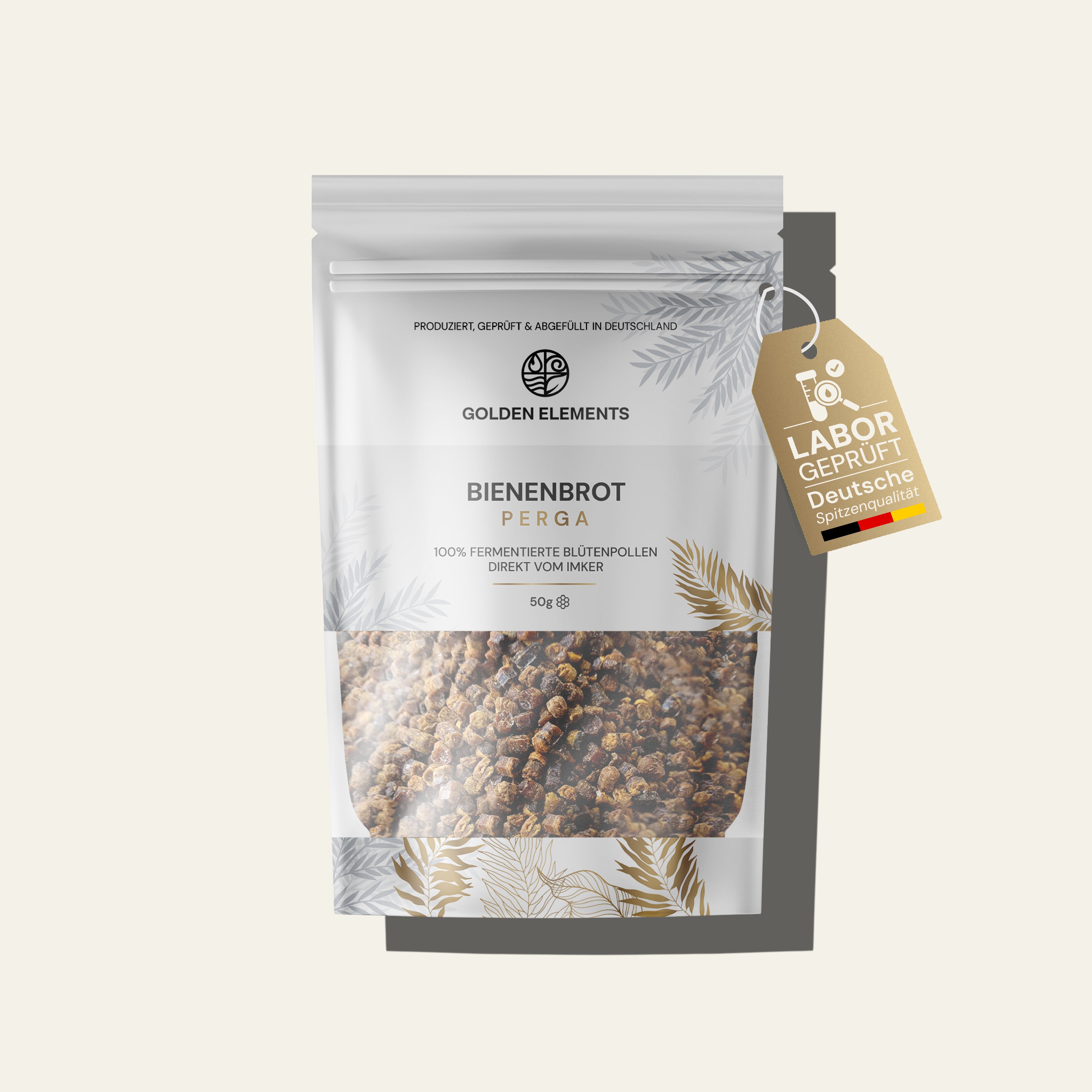 Standbeutel von Golden Elements mit Bienenbrot (Perga). Die Verpackung ist weiß mit goldenen Blättermotiven, zeigt durch ein Sichtfenster die fermentierten Blütenpollen und trägt die Aufschrift „100% fermentierte Blütenpollen direkt vom Imker