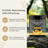 Golden Elements Elektrolyte Komplex Pulver Mango Geschmack – Produktfoto im Grünen mit Fokus auf fruchtige Frische und Dosierung