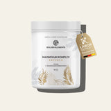 Golden Elements Magnesium Komplex Kapseln in weißer Dose mit goldenen Pflanzenmustern, vegan mit 3-Magnesiumverbindungen.