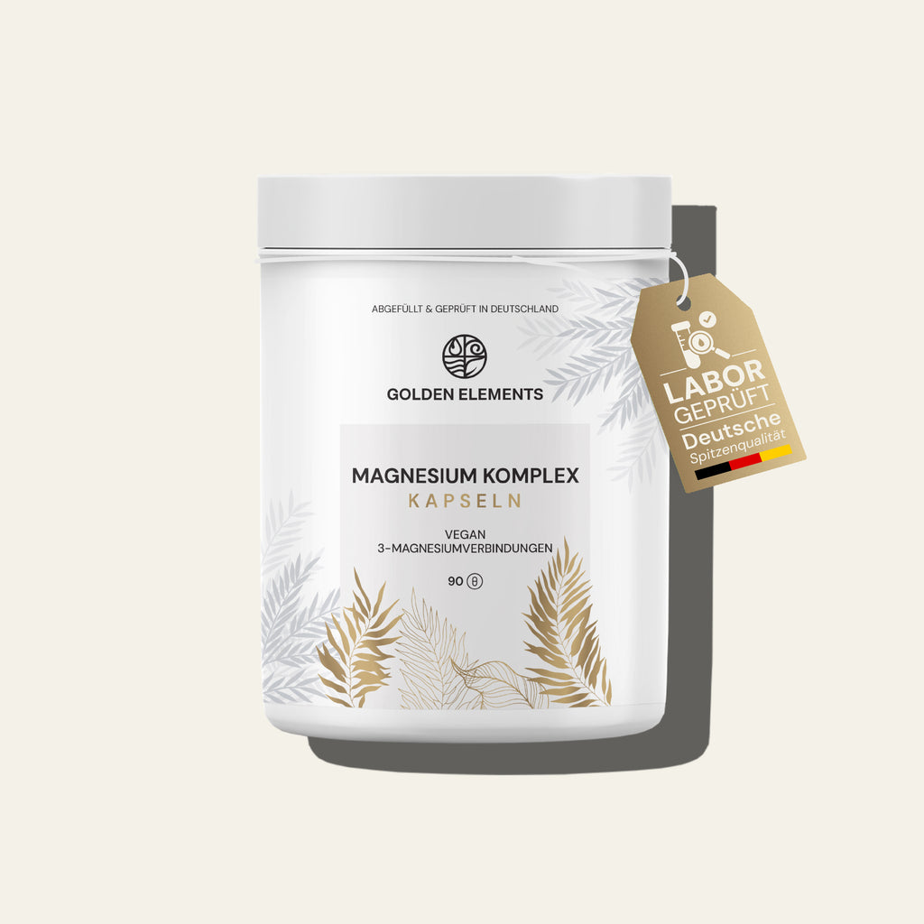 Golden Elements Magnesium Komplex Kapseln in weißer Dose mit goldenen Pflanzenmustern, vegan mit 3-Magnesiumverbindungen.